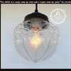 Embossed antique glass globe pendant light with clear glass shade & dark bronze finish.