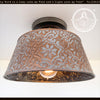 Ornate copper ceiling light fixture with embossed floral pattern; The Lamp Goods.