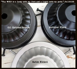 Vintage-style light fixture bases in oil-rubbed bronze, antique black, and satin nickel finishes.