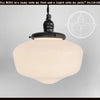 Milk glass 'Heritage' pendant light with exposed socket and black metal fixture.
