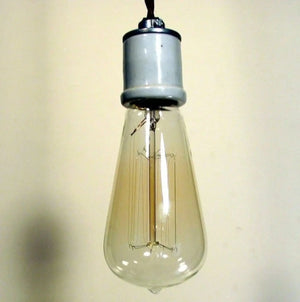 Dimmable 60-watt bulb with a ceramic socket, hanging against a neutral background.