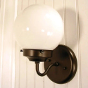Modern bronze wall sconce with a frosted glass globe shade.