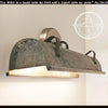 Galvanized metal wall vanity light with leather accents, from The Lamp Goods.