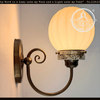 Ribbed Milk Glass Globe and Brass Wall Sconce