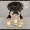 Antique pressed glass ceiling light fixture; trio with dark bronze finish & chain hanging.
