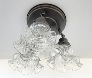Clear glass hobnail ceiling light fixture with ruffled edges, vintage 1930s style.
