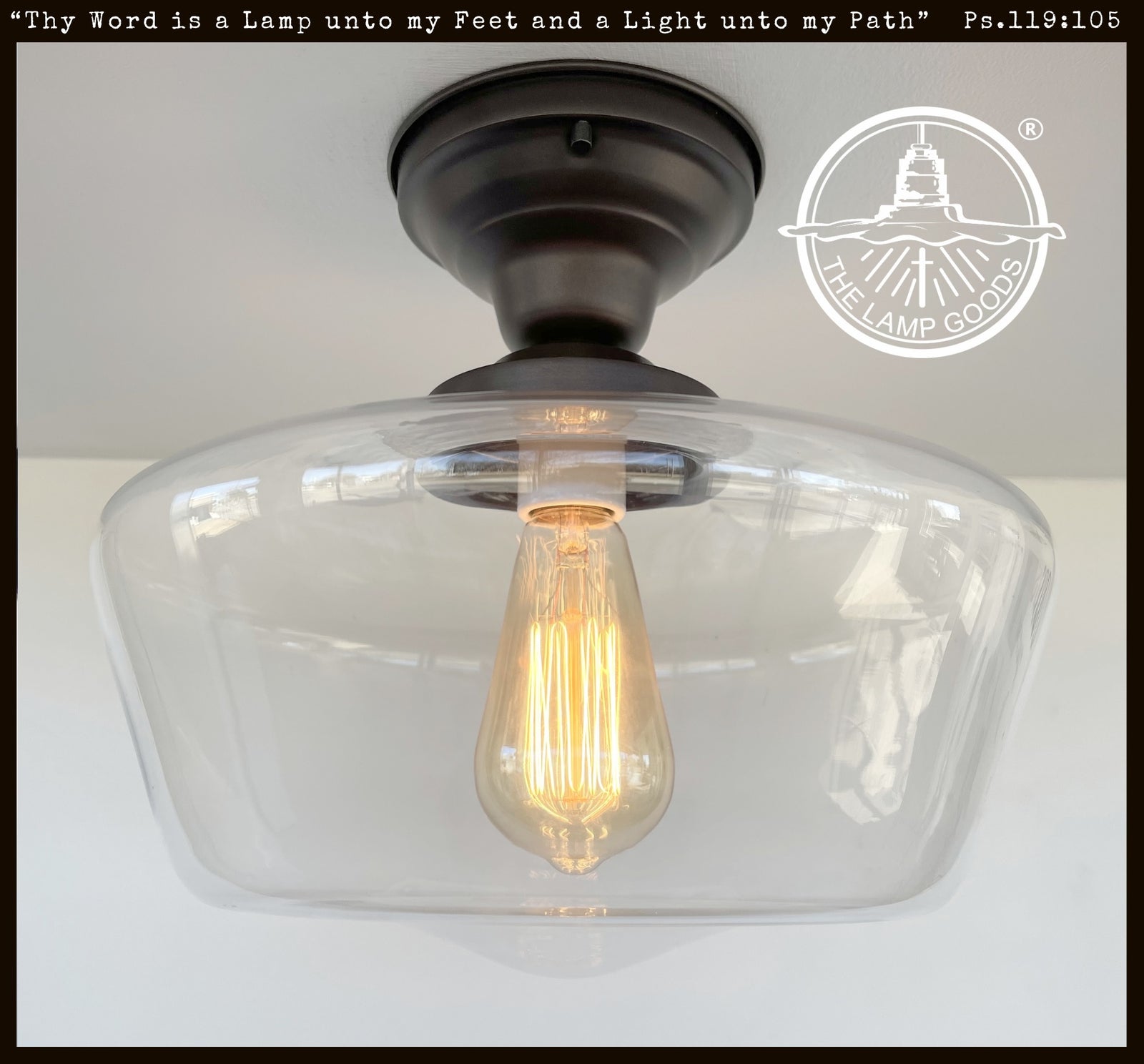 Large Schoolhouse Clear Glass Ceiling Light fixture with bronze finish from The Lamp Goods.

