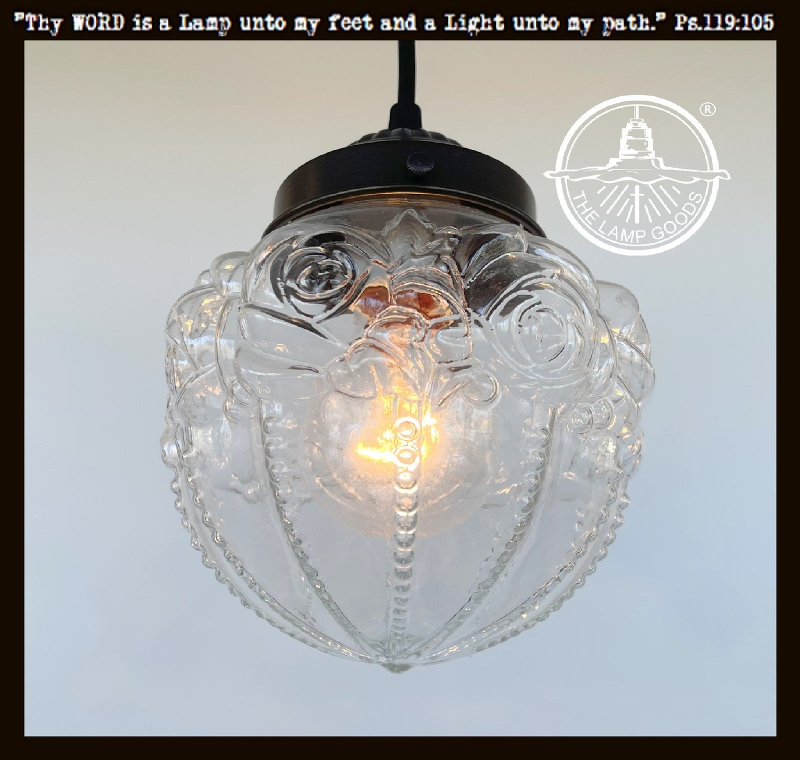 Embossed antique glass globe pendant light with clear glass shade & dark bronze finish.
