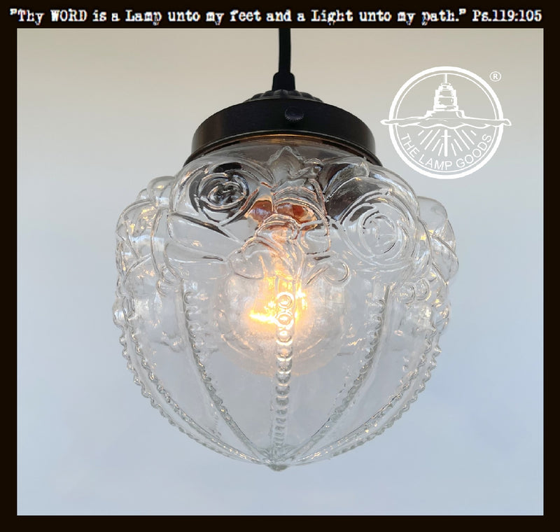 Embossed antique glass globe pendant light with clear glass shade & dark bronze finish.
