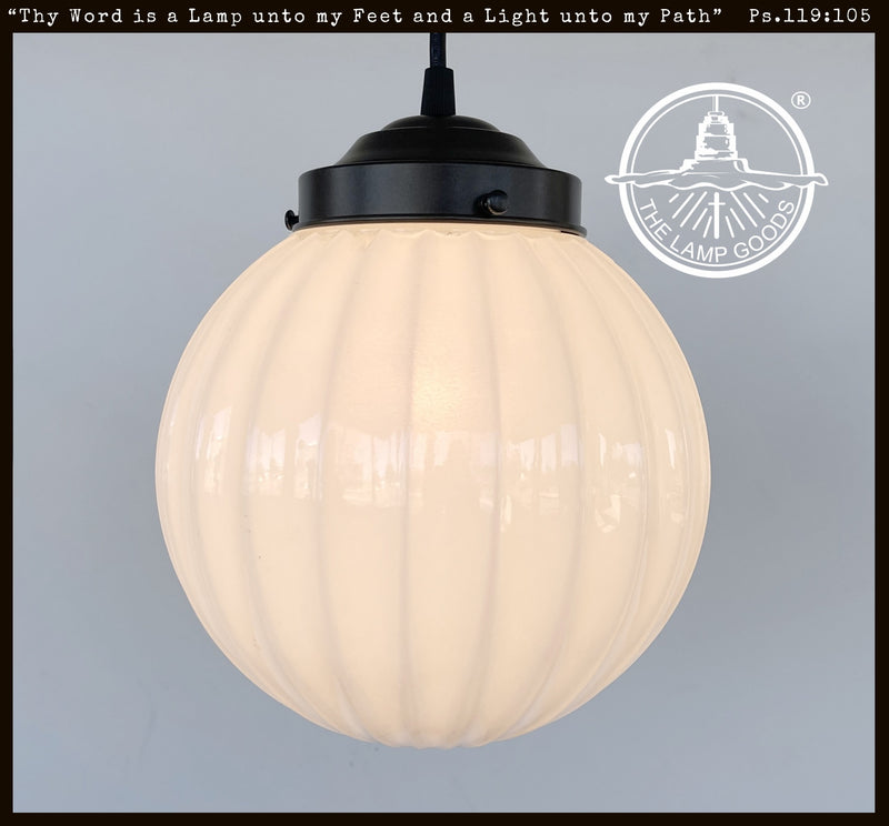 Authentic 1960s milk glass pendant light with ribbed detailing & black canopy.
