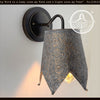 Ornate copper Jubilant wall sconce with embossed detail; dark bronze finish.
