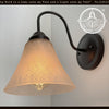 Modern Farmhouse linen glass wall sconce with bronze finish.
