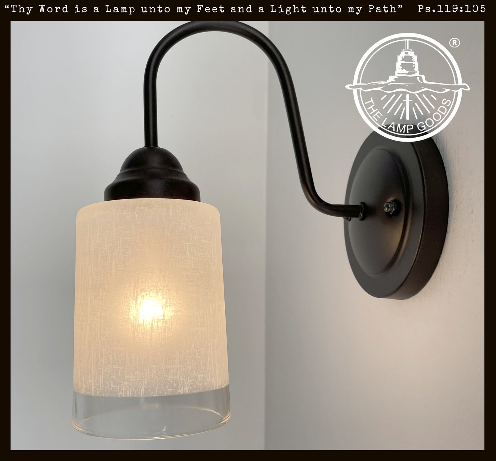 Modern Farmhouse linen & clear glass wall sconce; black metal, warm light.
