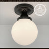MODERN OPAL globe ceiling light fixture, black metal base, opal glass shade.
