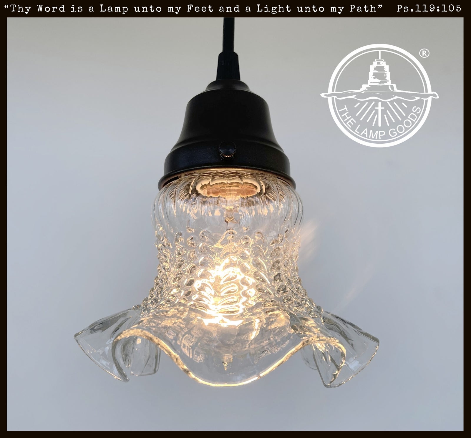 Antique 1930s hobnail glass pendant light, clear ruffled glass shade, black metal fixture.

