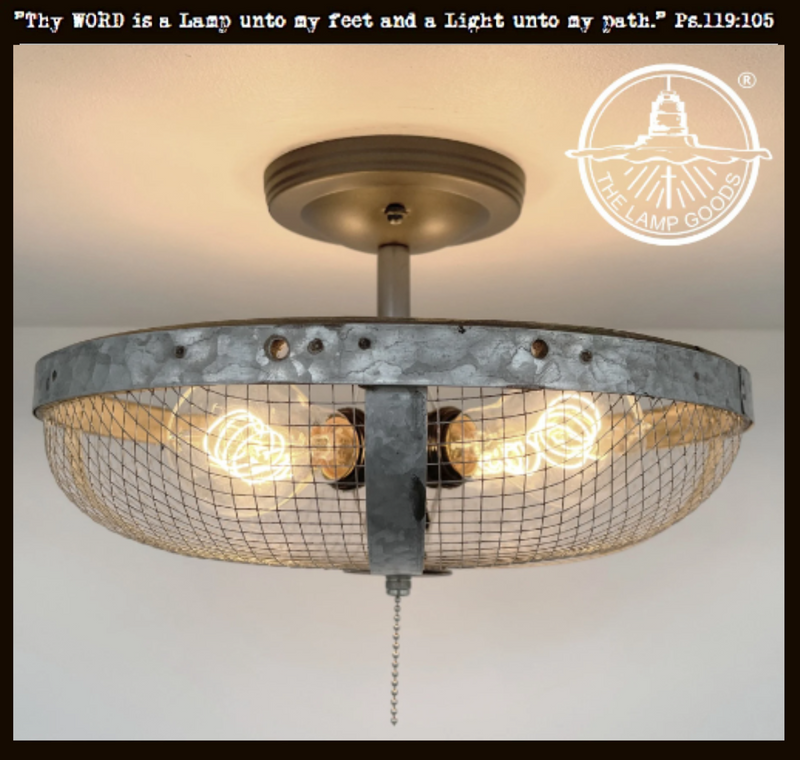 Industrial farmhouse flush mount ceiling light with galvanized metal shade and wire mesh.
