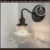 Antique Holophane glass wall sconces with ribbed glass shade & black metal base.
