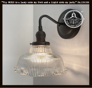 Antique Holophane glass wall sconces with ribbed glass shade & black metal base.

