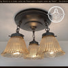 Antique amber 1930s Holophane hobnail glass ceiling light; 3-light fixture.
