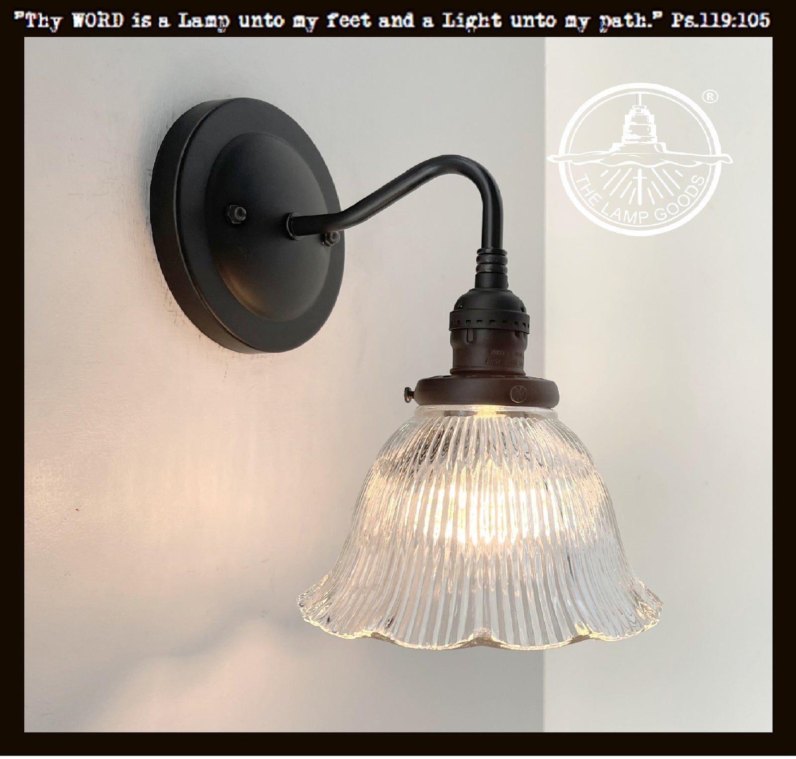 Antique Holophane glass wall sconce with ribbed dome shade & black metal arm.
