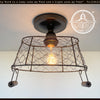 Farmhouse chicken wire rectangular ceiling light fixture with rustic bronze finish.
