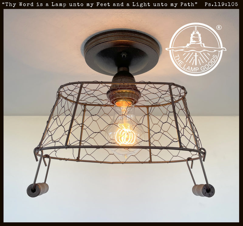 Farmhouse chicken wire rectangular ceiling light fixture with rustic bronze finish.
