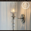 Modern Glass SCONCE wall sconce light fixture with clear glass shade and crystal accents.
