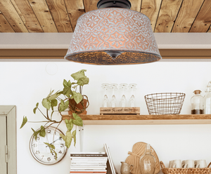Copper farmhouse ceiling light fixture with distressed finish, hanging in a rustic kitchen setting.
