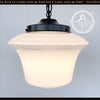 Large 1940s schoolhouse milk glass pendant light with black metal canopy.
