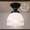 Retro 1950s glass ceiling light fixture with black metal canopy, cream glass shade, and textured glass accents.
