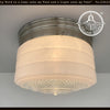 Retro flush mount milk glass ceiling light with brushed nickel finish, featuring a textured glass diffuser.
