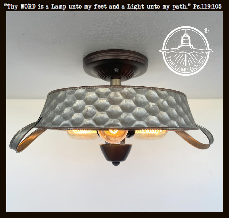 Rustic galvanized metal beehive ceiling light fixture with three lights; The Lamp Goods.
