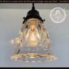 Vintage 1950s clear glass diamond pendant light fixture with black metal socket.
