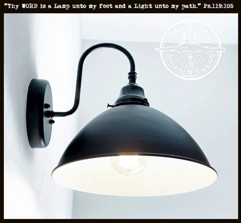 Black enamel farmhouse wall sconce with curved arm; adds rustic charm.
