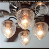 Kitchen ceiling fan light kit with four frosted glass shades; The Lamp Goods.
