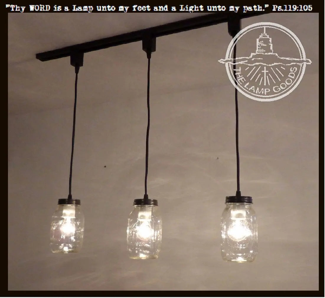 Mason Jar Track Lighting Pendant Trio: 3-light fixture with black cords & glass jars.
