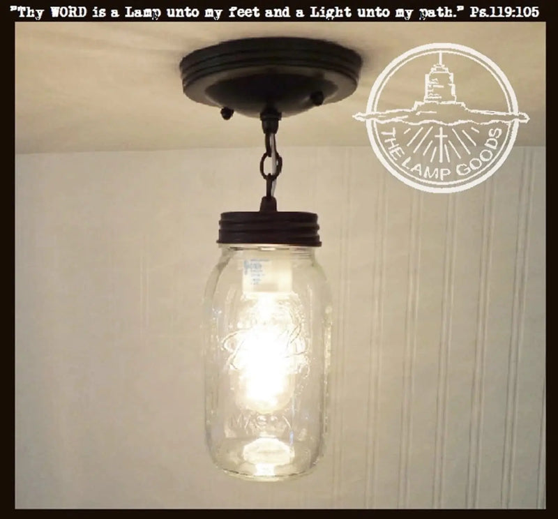 Mason jar ceiling light fixture with chain, quart-sized jar, and dark bronze finish.
