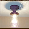 Purple mason jar farmhouse ceiling light fixture with black metal accents.
