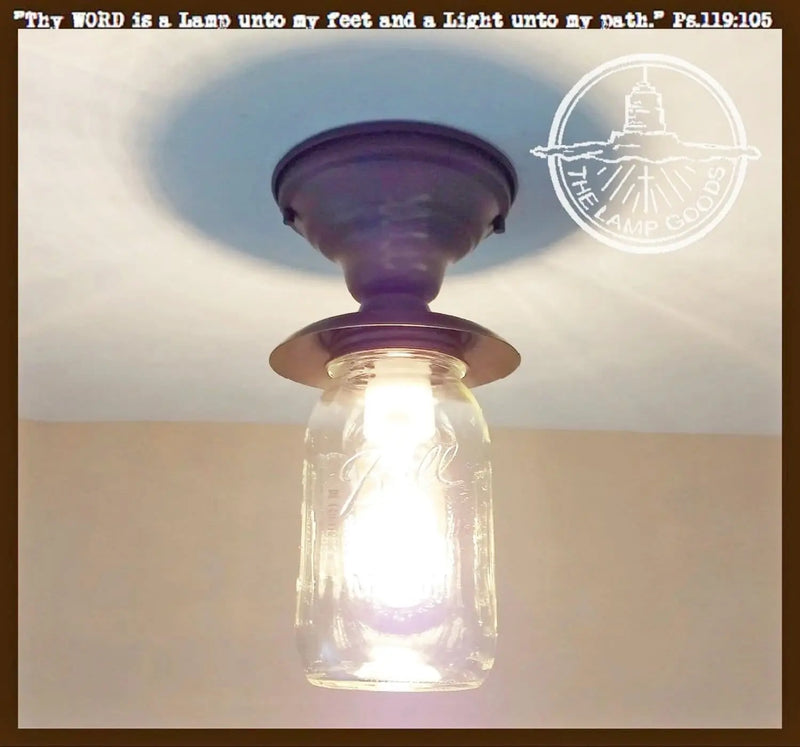 Purple mason jar farmhouse ceiling light fixture with black metal accents.
