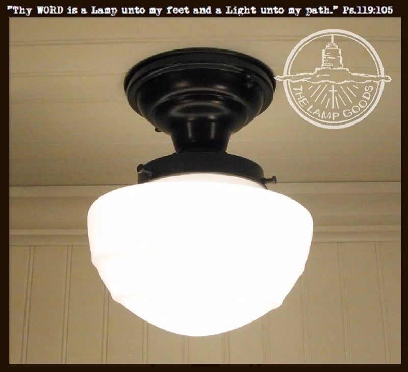 Milk glass mushroom ceiling light fixture with black metal canopy
