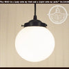 Milk glass globe pendant light with black metal fixture, The Lamp Goods
