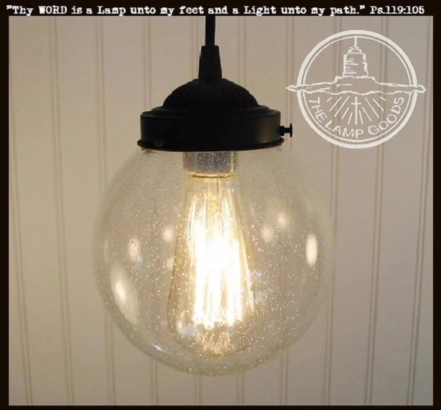 Antique seeded glass pendant light with black metal fixture.
