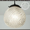 Clear glass Hobnail Swirl pendant light fixture with black metal fitting.
