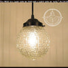 Clear glass Diamond Square antique pendant light with bronze finish.
