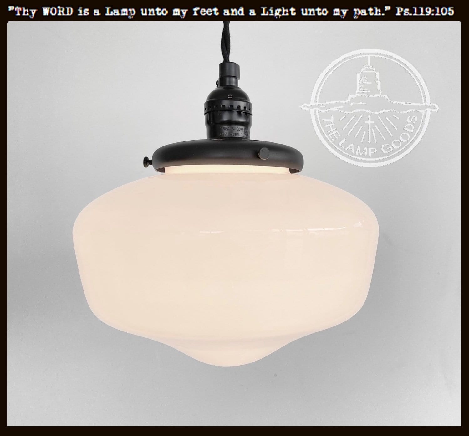 Milk glass 'Heritage' pendant light with exposed socket and black metal fixture.
