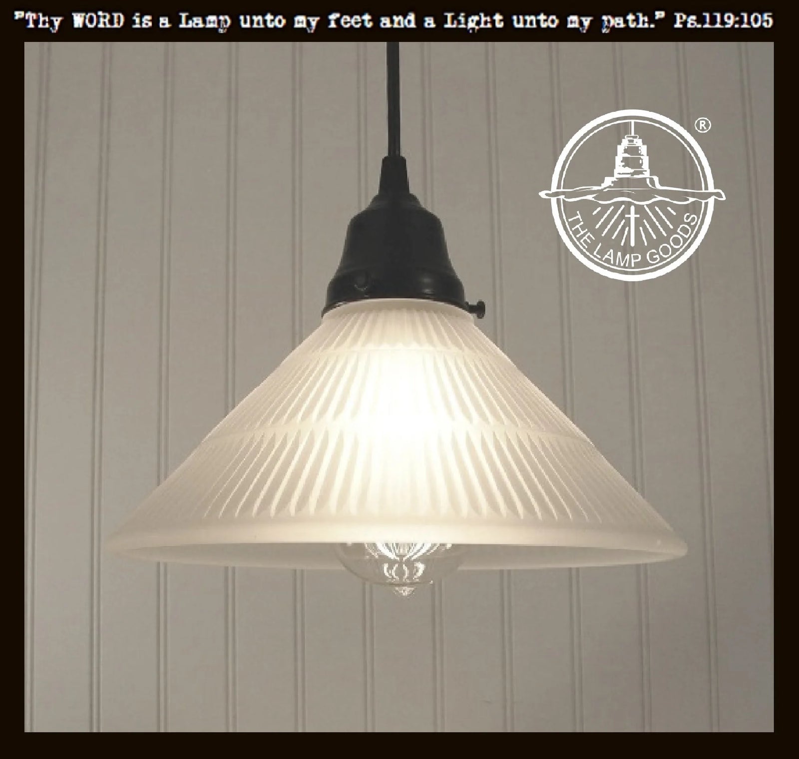 Frosted antique Holophane glass pendant light fixture with black metal canopy.
