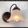 Frosted milk glass wall light with bronze finish, from The Lamp Goods.
