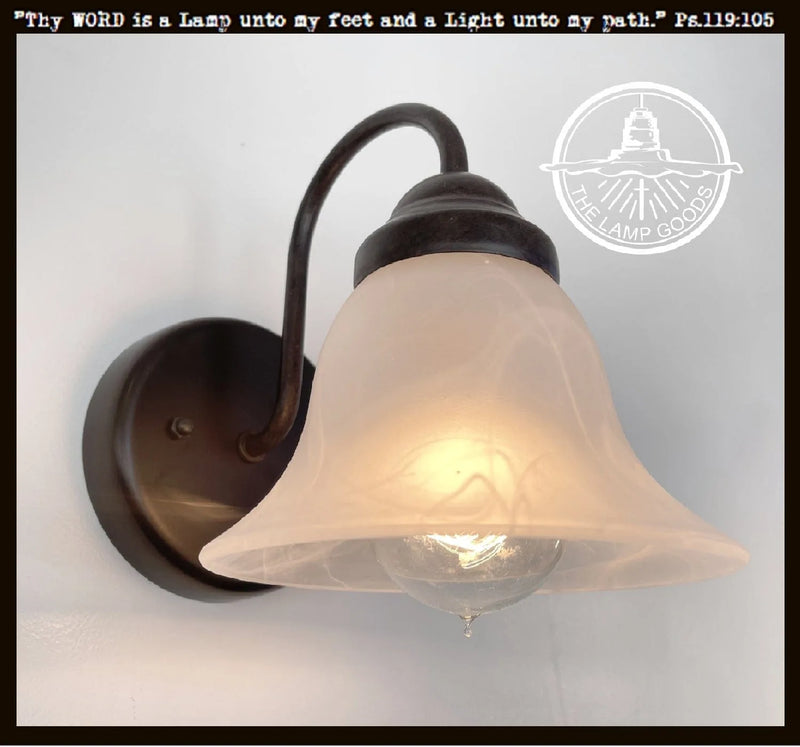 Frosted milk glass wall light with bronze finish, from The Lamp Goods.
