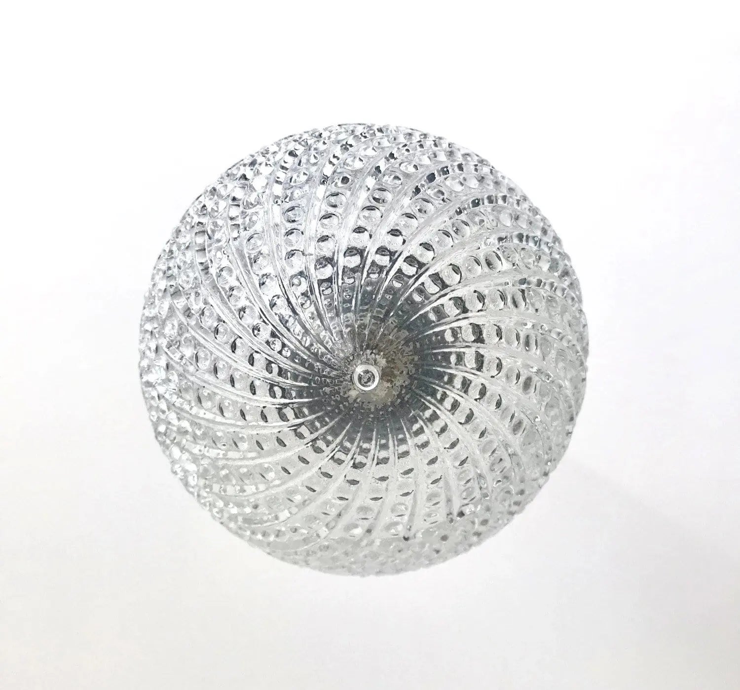 Clear glass pendant light fixture with hobnail swirl pattern.
