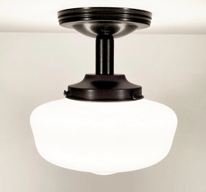 Antique milk glass ceiling fixture with dark bronze metal accents.
